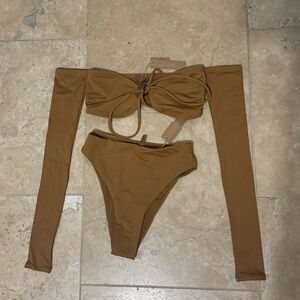 SKIMS long sleeve top and high rise bottoms. Condition is new with tags.